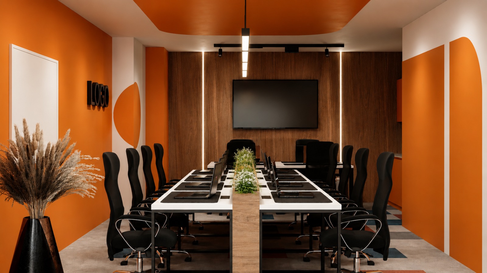 Training room at PRN CO-WORK with long table, wall screen and orange interior